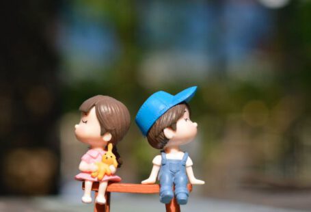 Love - Boy and Girl Sitting on Bench Toy