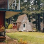 Bermuda Triangle - A cabin in the woods with a porch and a deck