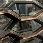 Manhattan Project - Futuristic Hudson yards redevelopment project with staircases located on street near modern skyscrapers in downtown of famous megapolis in Manhattan