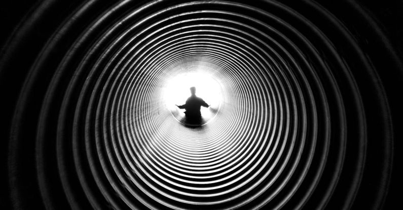 Black Hole - Grayscale Photography of Person at the End of Tunnel